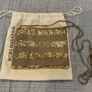 BCBG gold metal purse.